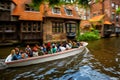 Tourist canal boat tour in Bruges Old Town, Belgium Royalty Free Stock Photo