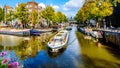 Tourist Canal Boats in the Brouwersgracht canal in Amsterdam Holland