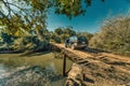 Tourist with car breakdown on a large, rickety wooden bridge in the wilderness of Paraguay. Royalty Free Stock Photo