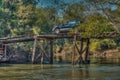 Tourist with car on a large, rickety wooden bridge in the wilderness of Paraguay. Royalty Free Stock Photo