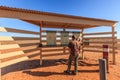 Tourist carefully reads the information and directions for entering Lake Eyre National Park South Australia