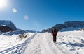 Tourist climber on a mountain snow trail