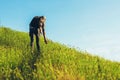 Tourist climbing to the summit, Young man climbing a mountain, Climber success on the summit, Adventure outdoor Royalty Free Stock Photo