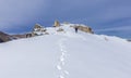 Tourist climbs the snow-capped peak of the snow-capped mountains