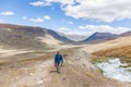 Tourist climbs uphill. The nature of Mongolia