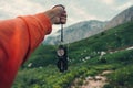 Tourist with compass in mountains Royalty Free Stock Photo