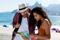 Tourist at Rio de Janeiro and brzailian woman looking at map