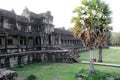 Tourist couple cycling around Angkor temple, Cambodia. Ta Keo building ruins in the jungle. Eco friendly tourism Royalty Free Stock Photo