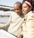 Tourist couple in London with map. Royalty Free Stock Photo