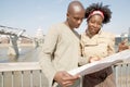 Tourist couple in London with map. Royalty Free Stock Photo