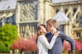 Tourist couple in Paris sitting near Notre-Dame Royalty Free Stock Photo