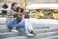 Tourist couple photographing on steps