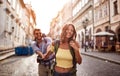 Happy tourist couple sightseeing; Traveller lifestyle