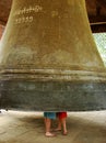 Tourist couple standing inside Mingun bell, Mandalay region, Myanmar Royalty Free Stock Photo