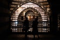 Tourist couple taking picture inside historic Old City of Damascus (Khan As\'ad Pasha