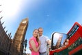 Tourist couple taking selfie against Big Ben in London, England, UK Royalty Free Stock Photo