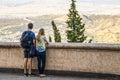 Tourist couple at wall overlooking blurred vista - Tbilisi Georgia - Selective focus