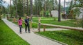 Tourist couple waving goodby to fellow tourists at a glamping site in Lake Bloke, Nova Vas, Slovenia Royalty Free Stock Photo