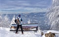 Tourist, cross country skier with backpack admires Tatra Mountains