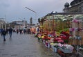 Tourist crowd, florist flower shops at Taksim Square Istanbul Turkey with Hagia Triada Greek Orthodox Church