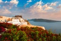 Tourist crowd gathered to watch the sunset in Oia Village, Santorini island, Greece Royalty Free Stock Photo