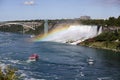 Tourist cruise Ship boat under Rainbow on The Niagara River visiting the Water Falls on a sunny Summer Day Royalty Free Stock Photo