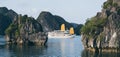 Tourist cruise ships sailing among limestone mountains in Halong Bay, Vietnam Royalty Free Stock Photo