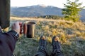 Tourist with a cup of coffee in tent with mountain view