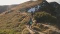 Tourist dance on mountain sun top closeup aerial. Autumn nature landscape. People hike to mount peak