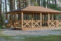 Large wooden gazebo in the forest, tourist destination