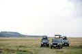 Tourist doing photography during game drive on safari Jeep in Masai Mara National Reserve Royalty Free Stock Photo