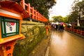 Tourist down the path passing the street lanterns spring time japan