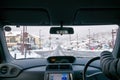Tourist drive the car on road with fresh white snow fall