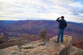 Tourist on the edge of Grand Canyon