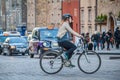 Tourist in Edinburgh riding bike