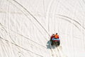 Tourist enjoy riding the quad bike or powerful fast off-road four-wheel drive ATVs at white sand dunes