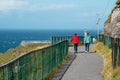 Tourist enjoy view of Mizen head in county Cork