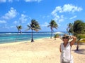 A Tourist Enjoying the Beach on Cayman Brac Royalty Free Stock Photo