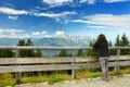 Tourist enjoying breathtaking lansdcape of Bavarian Alps with majestic mountains in the background.