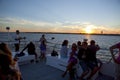 Tourist enjoying a charter sunset cruise in New Jersey