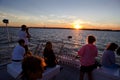 Tourist enjoying a charter sunset cruise in New Jersey