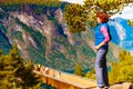 Tourist enjoying mountains fjord view, Norway Royalty Free Stock Photo