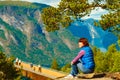 Tourist enjoying mountains fjord view, Norway Royalty Free Stock Photo