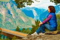 Tourist enjoying mountains fjord view, Norway Royalty Free Stock Photo