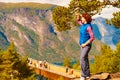 Tourist enjoying mountains fjord view, Norway Royalty Free Stock Photo