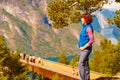 Tourist enjoying mountains fjord view, Norway Royalty Free Stock Photo