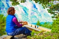 Tourist enjoying mountains fjord view, Norway Royalty Free Stock Photo