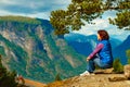 Tourist enjoying mountains fjord view, Norway Royalty Free Stock Photo