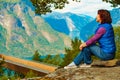 Tourist enjoying mountains fjord view, Norway Royalty Free Stock Photo