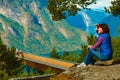 Tourist enjoying mountains fjord view, Norway Royalty Free Stock Photo